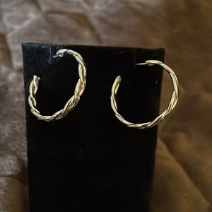 Silver tone twisted hoop earrings